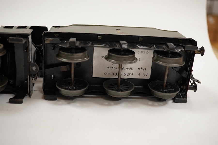 An 0 gauge Bassett-Lowke clockwork tinplate BR 4-4-0 tender locomotive, Prince Charles 62453, in dark green livery with orange and black lining and original clockwork mechanism